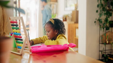 young girl doing homework at home