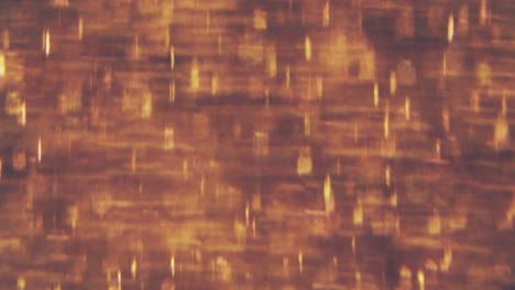 partículas doradas abstractas con borroso desfocado bokeh se mueve caos, copos de nieve