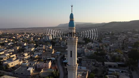 mosque in a desert town with communication signals