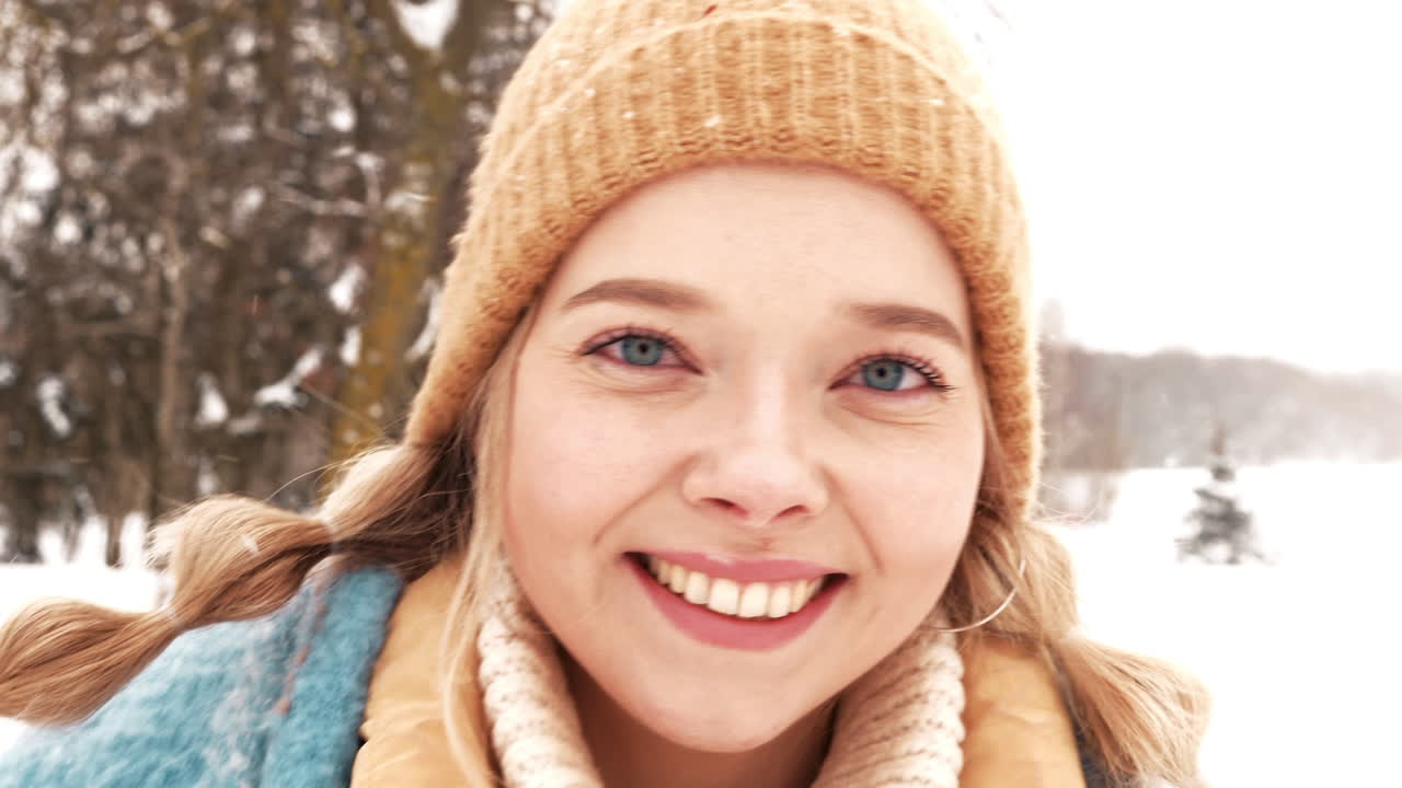 Woman Smiling in a Snow Park