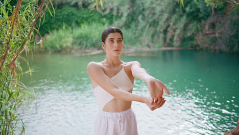 tender lady stretching hands tropics closeup. dancer warming before performance