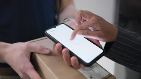 signing for a delivery on a smartphone