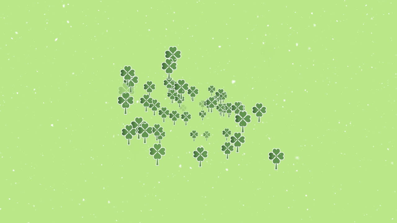 녹색 배경 에 있는 클로버 잎 위 에 내리는 눈 의 애니메이션