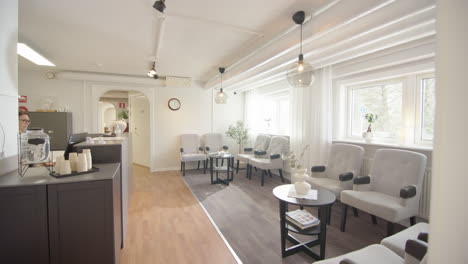 pov walking into stylish waiting room of health centre with receptionist