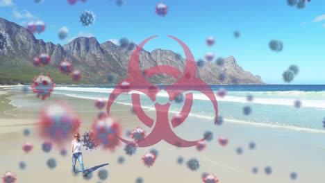 video compuesto digital de señales de peligro y células de covid-19 flotando contra una mujer caminando en una playa
