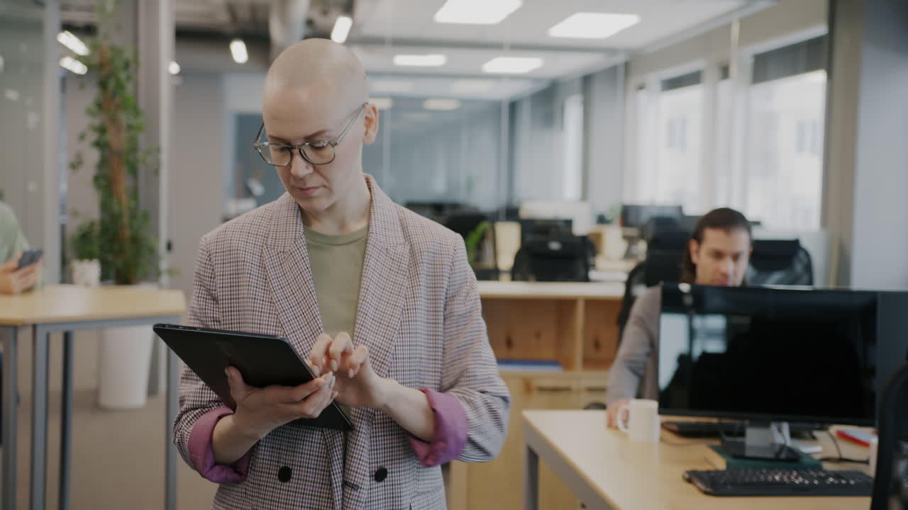 Woman using tablet in modern office