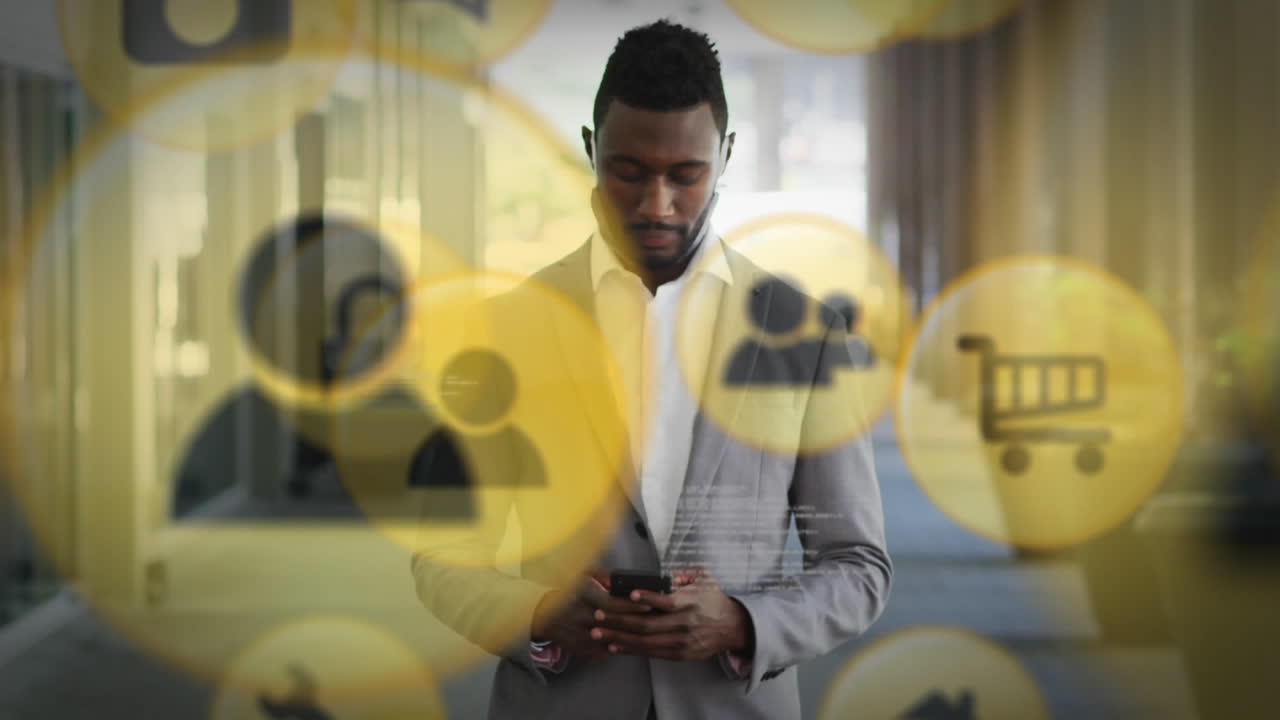 Multiple digital icons floating against man with lowered face mask using smartphone