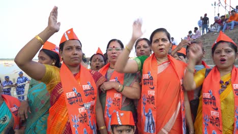 women bjp supporters chanting slogans to support chief minister yogi adityanath lok sabha election campaign rally at assi ghat