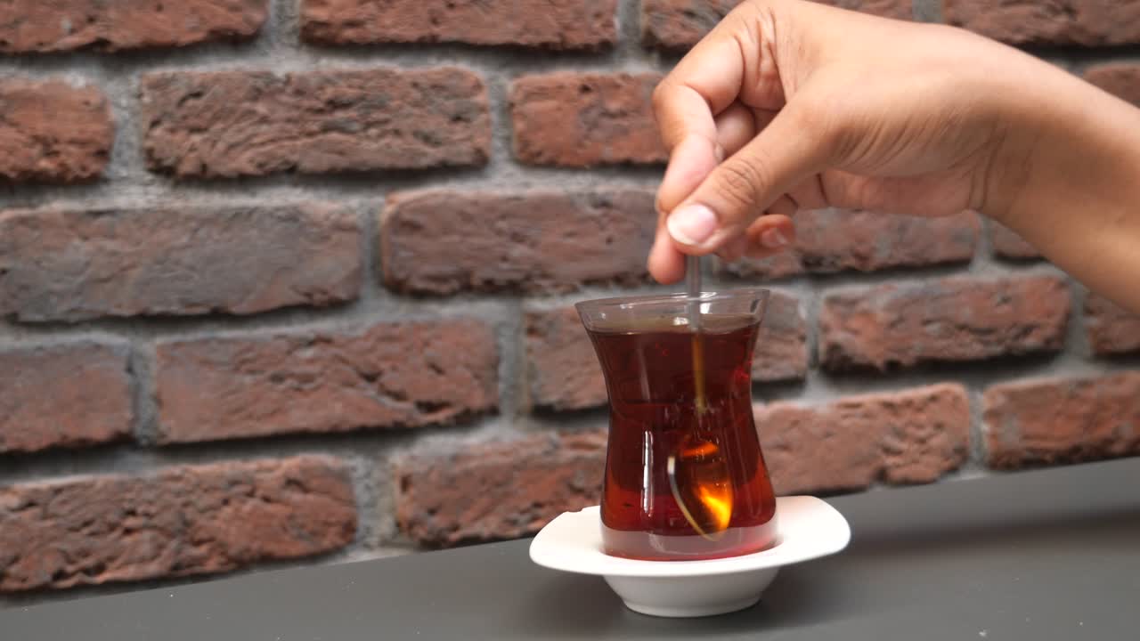 Close-up of Turkish Tea in a Glass with a Spoon