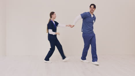 Couple,-happy-and-nurse-dancing-together