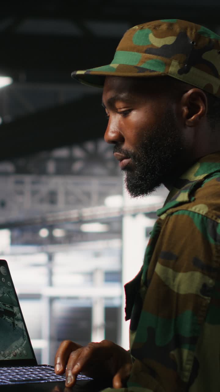 Vertical video Soldier in server room uses geospatial data to support emergency operations