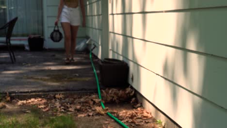 Angled-view-of-a-young-woman-walking-away-with-a-candle