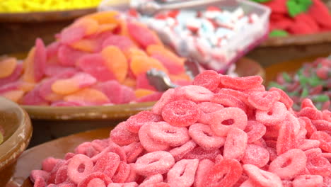 bowls full of colorful sweets candies for sale on the market