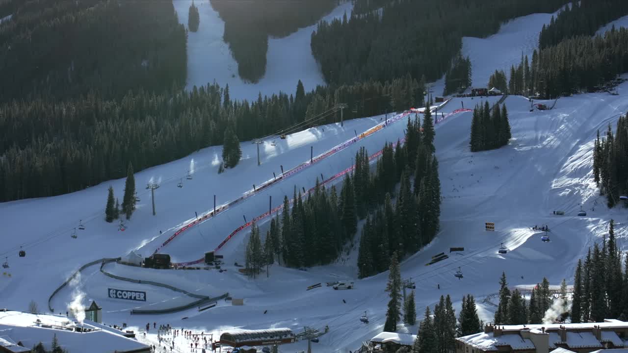 Copper Mountain Ski Resort aerial drone view chairlifts gondola halfpipe competition center village Ikon Pass Alterra snowboarding skiing early morning winter solstice December fresh snow pan down