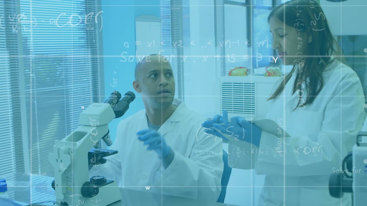 Lab team discussing as female showing tablet, male adjusting microscope, formulas grid overlaying