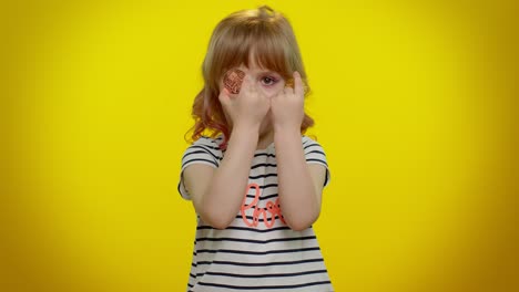 blonde child girl kid showing golden bitcoins, cryptocurrency investment, mining, future technology