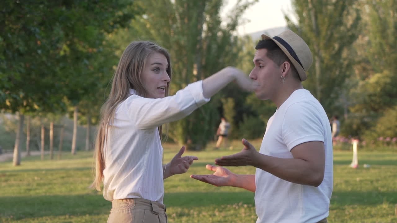 Young couple arguing in the park
