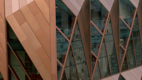 modern copper-clad building with geometric facade