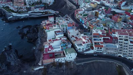 Awesome-Scenery-Of-City-Of-Los-Gigantes-in-Spain-Tenerife-Drone-Shot-in-4K-Buildings-At-Seaside-Seashore-Island-With-Mountains-At-The-Back