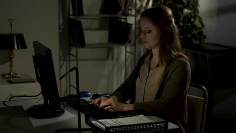 female office worker working late, typing, yawning, stretching-5