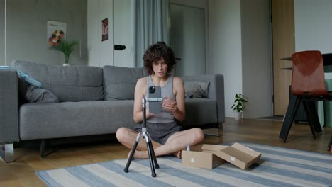 woman reviewing a new phone case and product