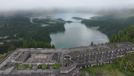 Aerial-reveal-shot-of-abandoned-hotel-Monte-palace-at-São-Miguel,-Azores