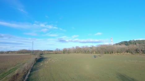FPV-drone-tracking-another-FPV-drone-in-the-countryside-and-around-a-pylon
