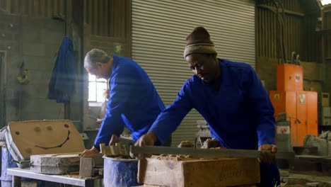 workers putting soil in wooden molds in workshop 4k