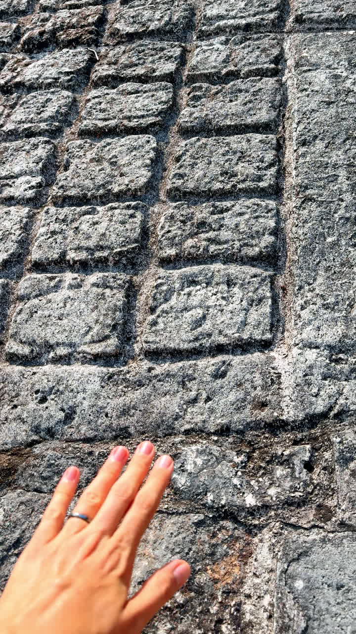 Ancient stone wall ruins in Mexico. Close view of historic stone wall ruins surrounded by greenery
