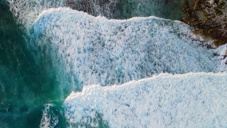 Beautiful sea waves with blue foam and abstract blue sea water