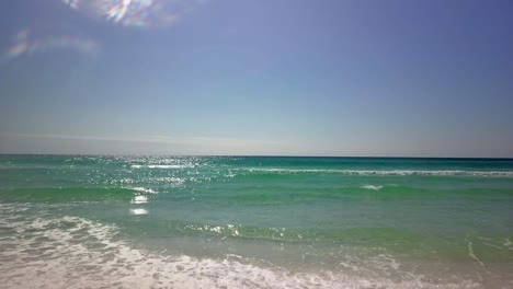 Flying-over-the-ocean-water-on-a-clear-and-sunny-day-1