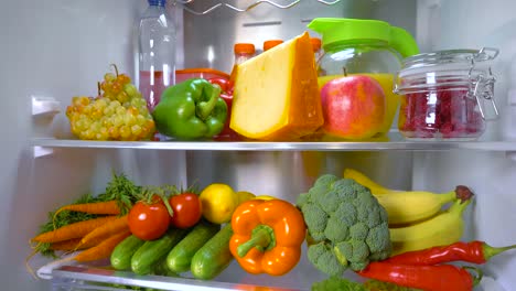 Open-refrigerator-filled-with-food