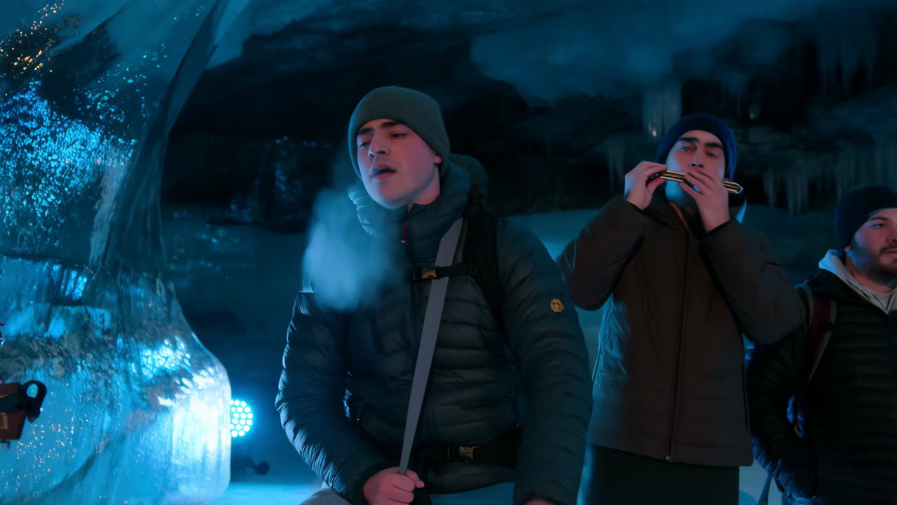 People singing and playing guitar in an ice cave