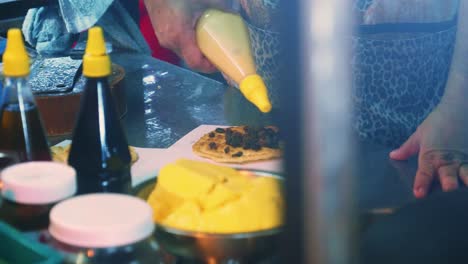 4k cinematic cooking footage of a thai chef preparing a traditionnal thai dessert called roti in a street market in thailand