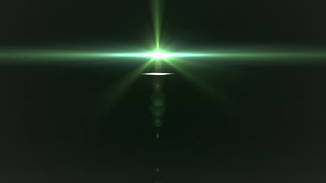 glowing green spot of light moving against black background