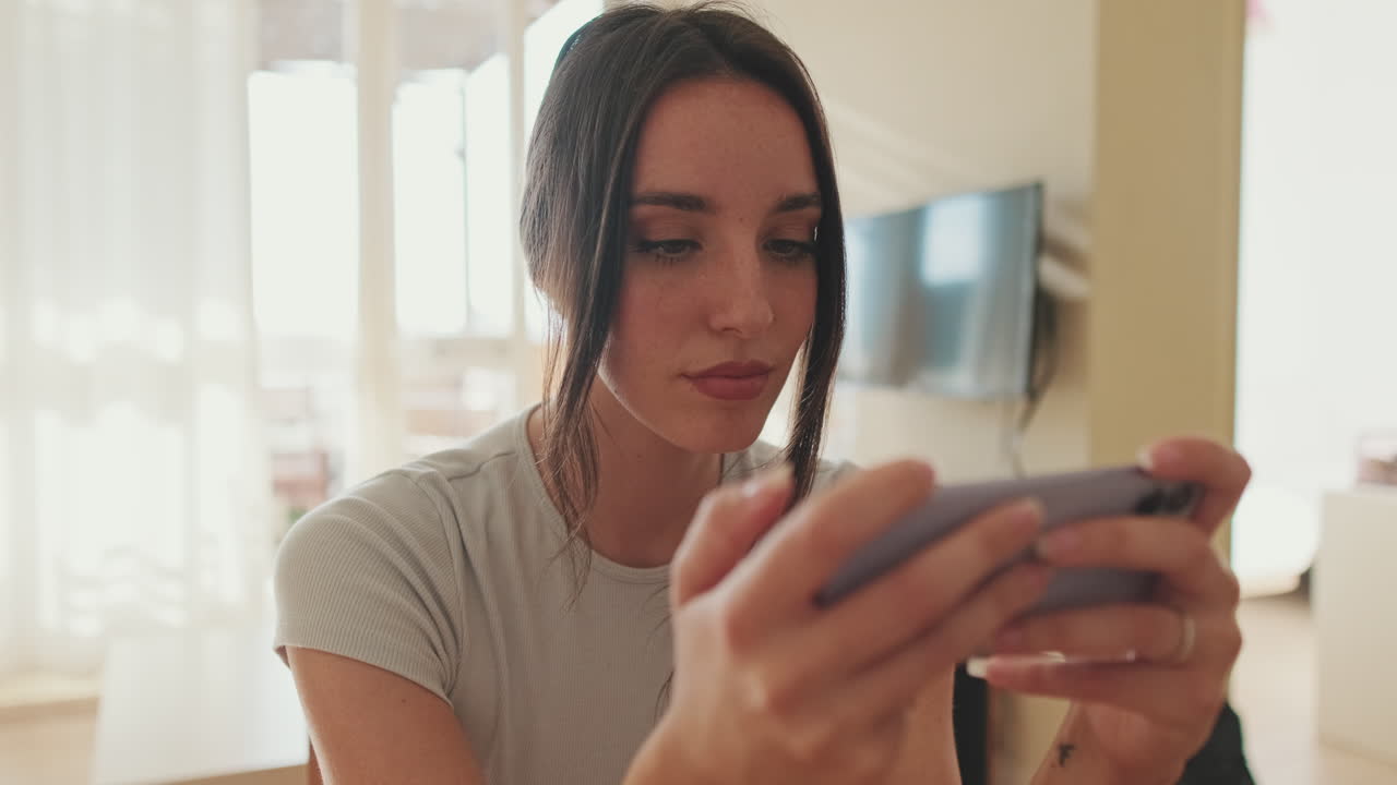 Woman playing mobile phone game