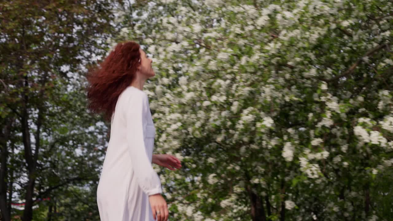 Woman enjoying spring flowers