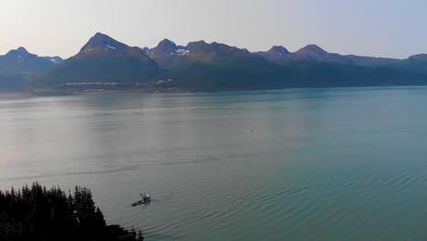 4k drone video of fishing boat near homestead trail in valdez ak during sunny summer day