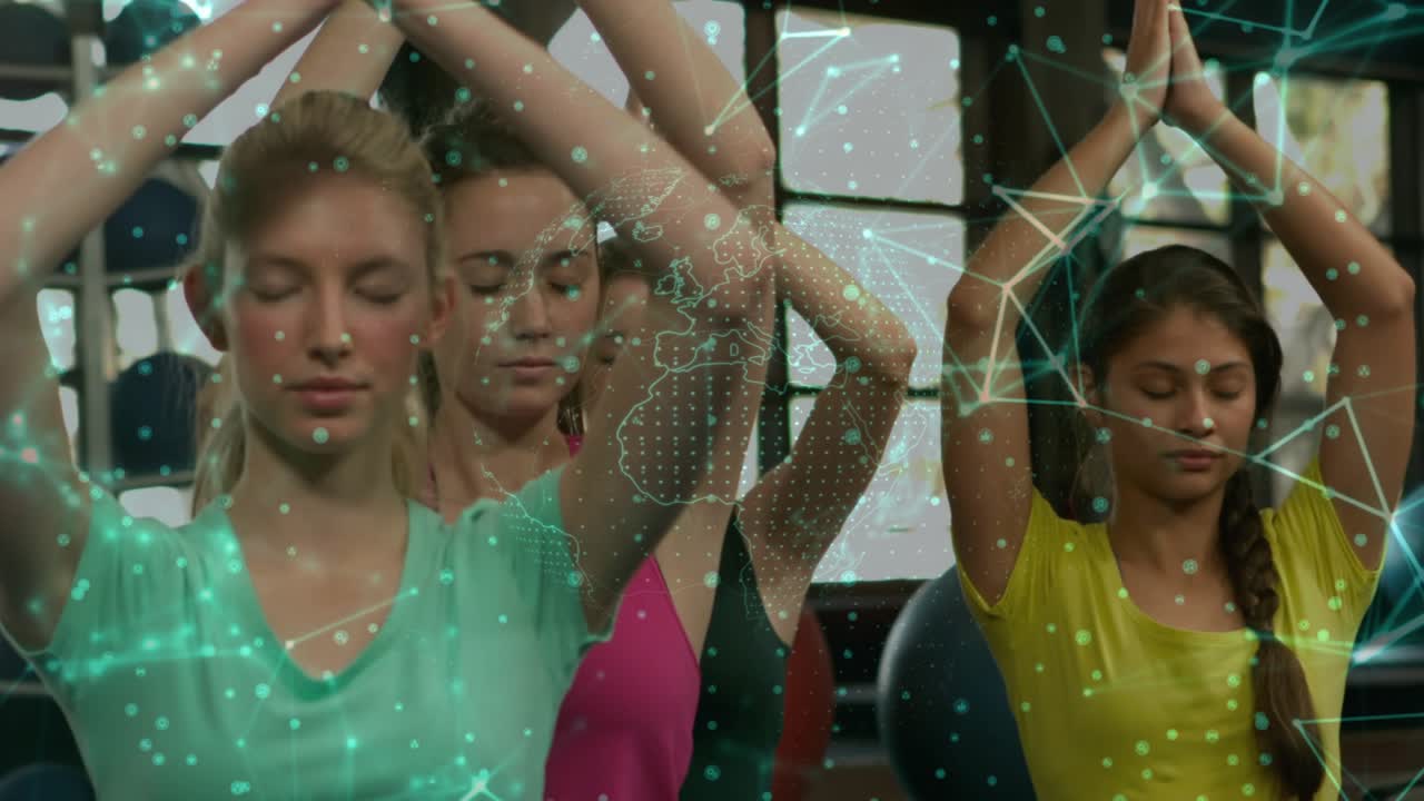 On instructor cue front woman lifting palms up in yoga, green overlay tracing faces for alignment