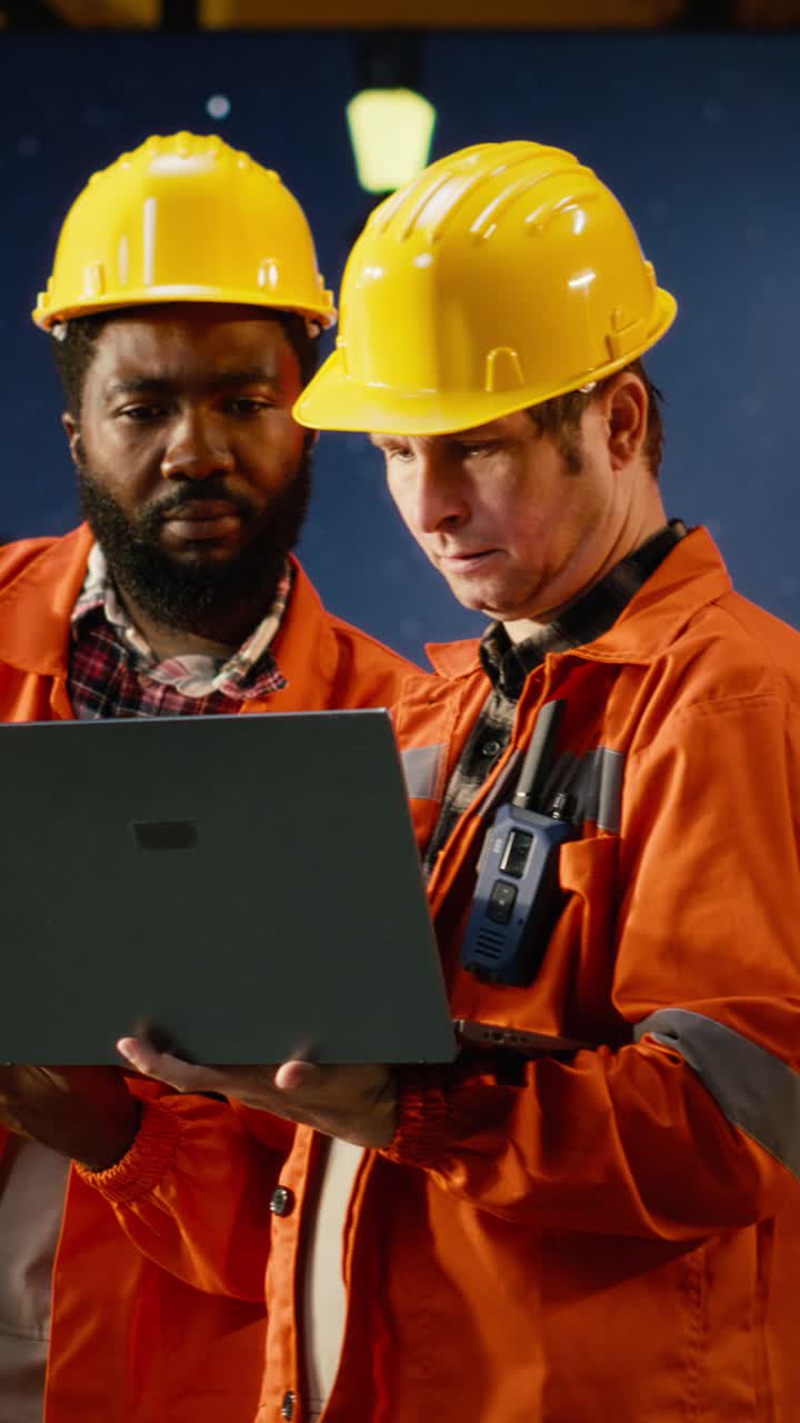 Vertical Video Environmental engineers on offshore platform conduct inspections