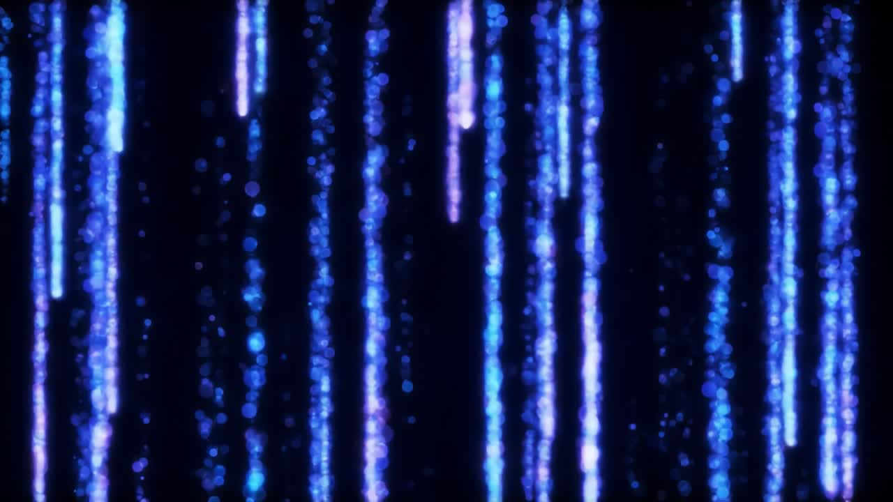 Bright, colorful lights cascade down in vibrant patterns, captivating onlookers at an outdoor event. The ambiance is lively as attendees enjoy the evening atmosphere filled with energy.