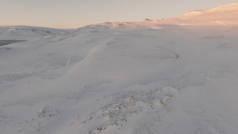 slow view at snowy mountain sunset, pan right dolly forward