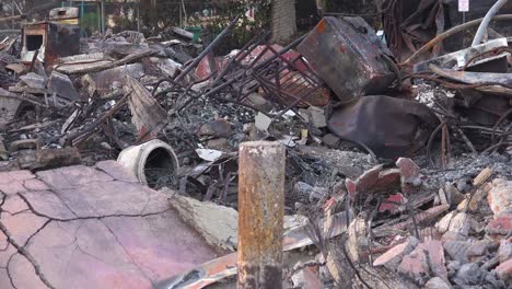 Pan-across-a-charred-and-burned-home-in-Ventura-California-following-the-Thomas-wildfire-in-2017