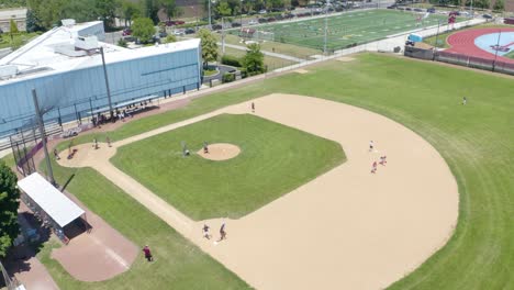 kids playing baseball during hot summer months in chicago