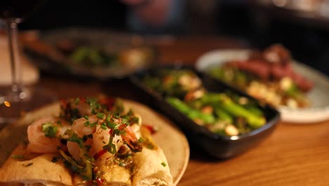 lemon juice being squeezed onto shrimp dish