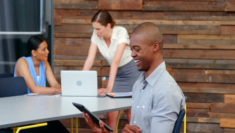 smiling business executive using digital tablet