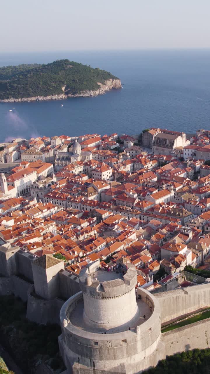 Aerial view of the Minceta Tower, part of the ancient walls surrounding Dubrovnik's old town in Croatia, a UNESCO World Heritage Site. Vertical video