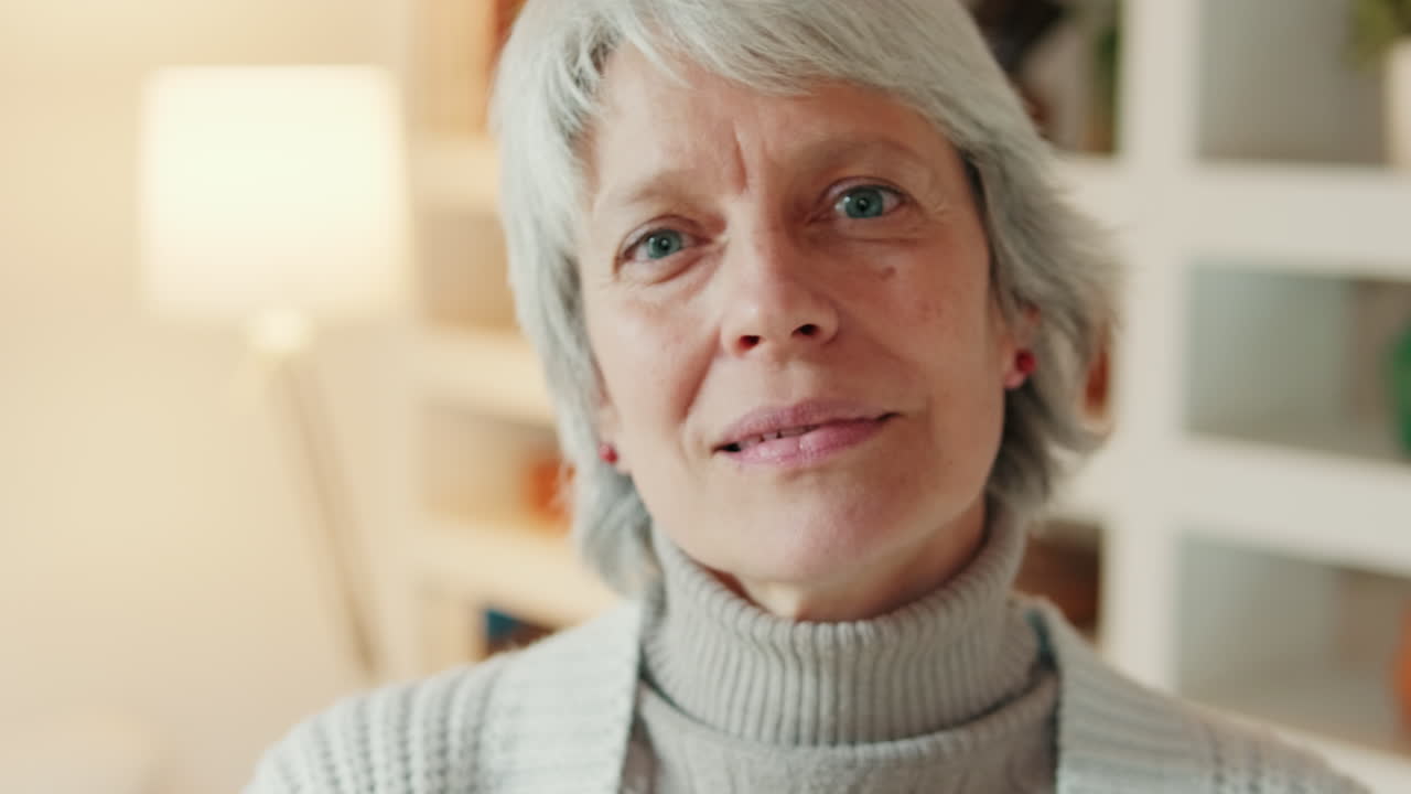 Close Up Portrait of a Thoughtful Senior Woman Looking at Camera