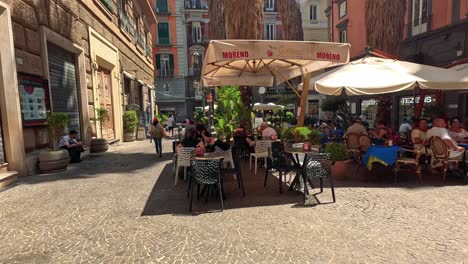 people enjoying a sunny day at a café