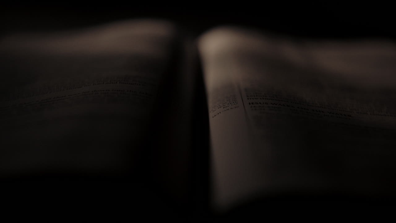 Open Bible Pages in Low Light